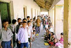School children waiting for vaccinations from IHO 