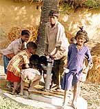 Kids at an IHO-installed water pump